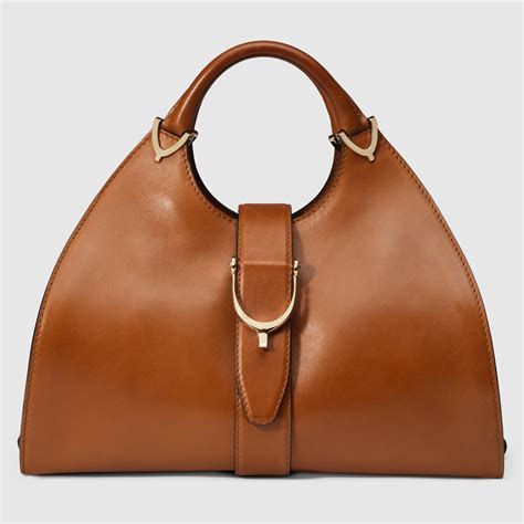 gucci stirrup leather top handle bag|Gucci mini handle bag.